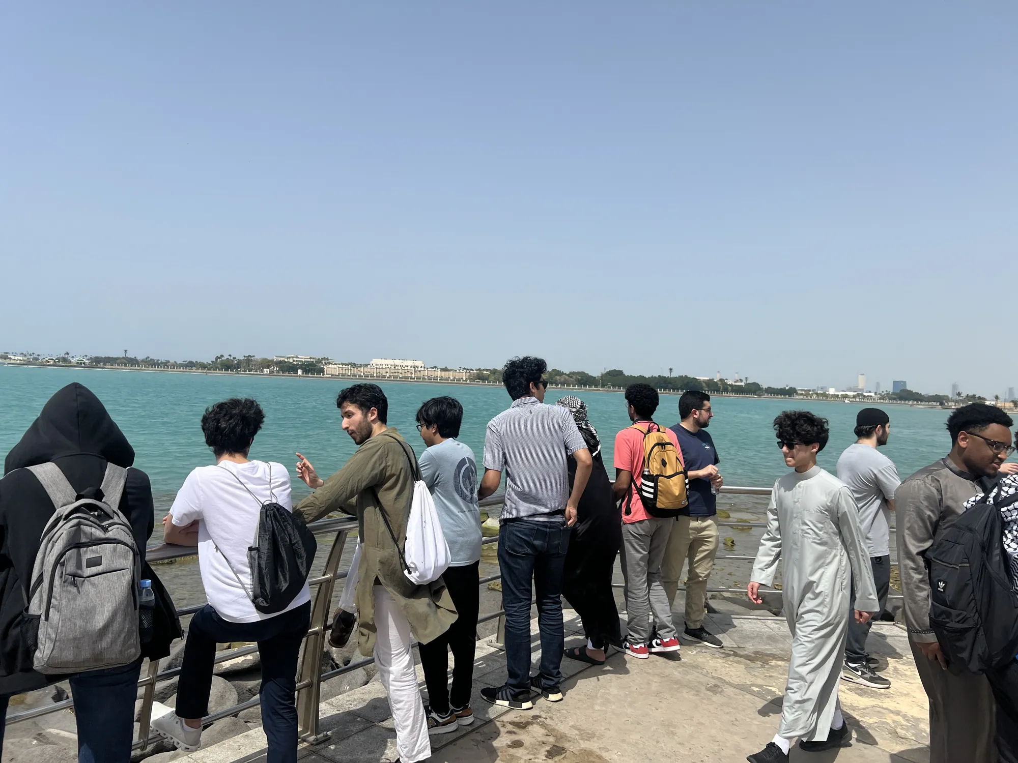 Students looking out over the water during an outing along the Red Sea waterfront in Jeddah.