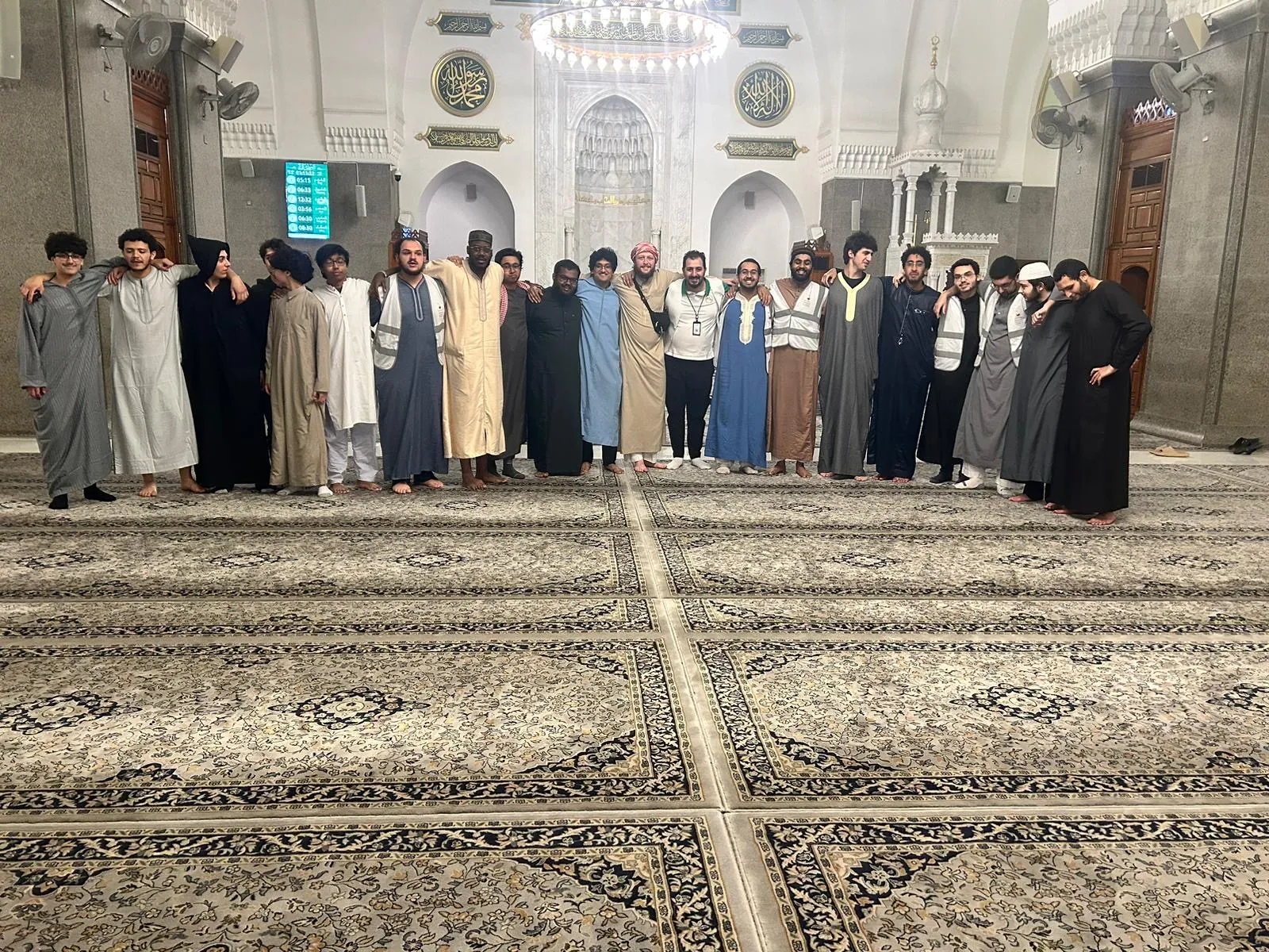 Students gathered together inside the prayer hall of Masjid Quba.